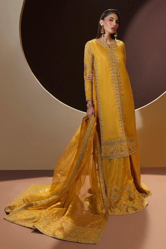 Portrait shot of MAYA dress showing neckline embroidery, fitted sleeves and tassel details