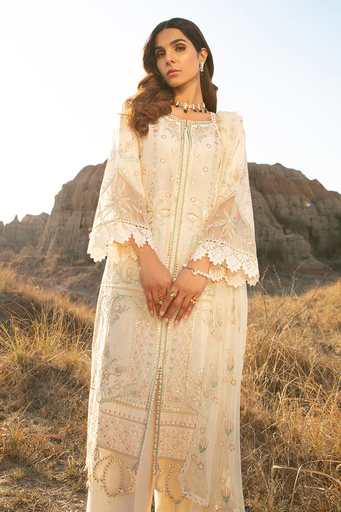 Front standing view showing long gown style off white shirt with detailed embroidery and lace work