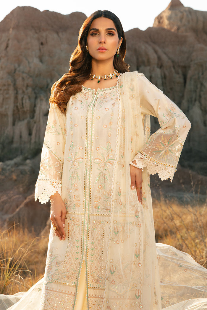 Walking view of off white embroidered outfit with flowing net dupatta and lace border ready to wear festive dress