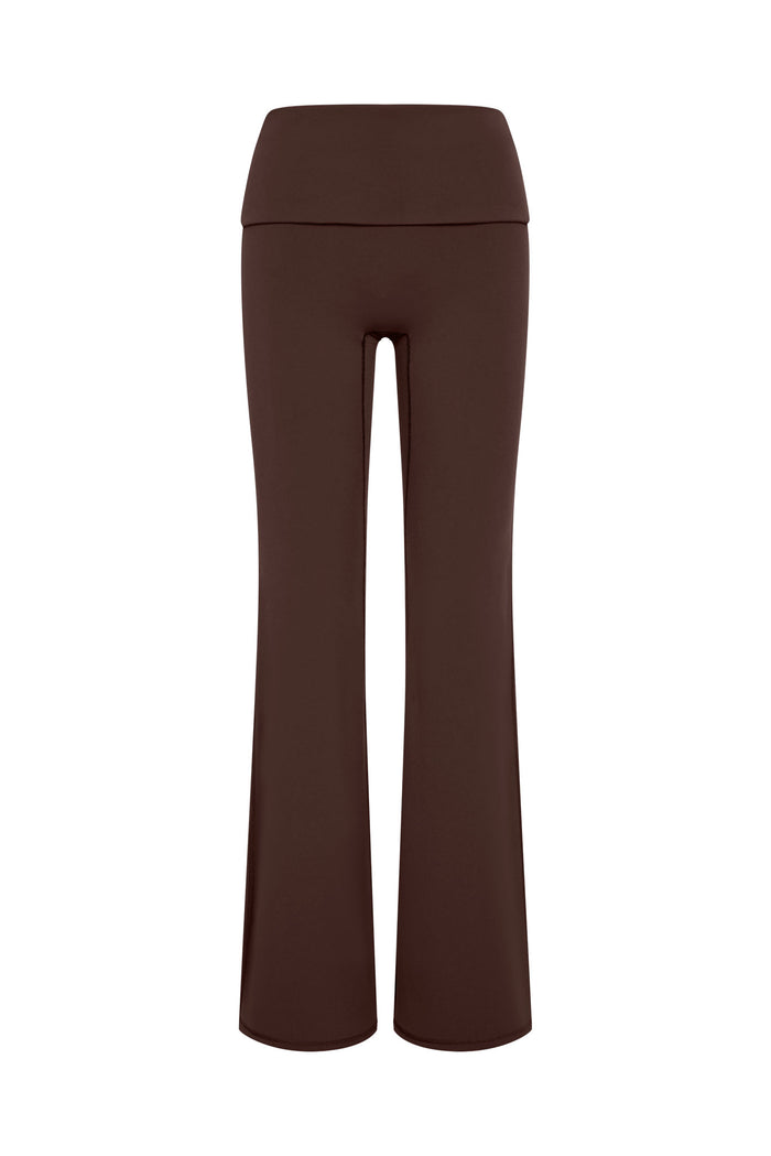 Brown high-waist flared leggings with wide foldover waistband on white background