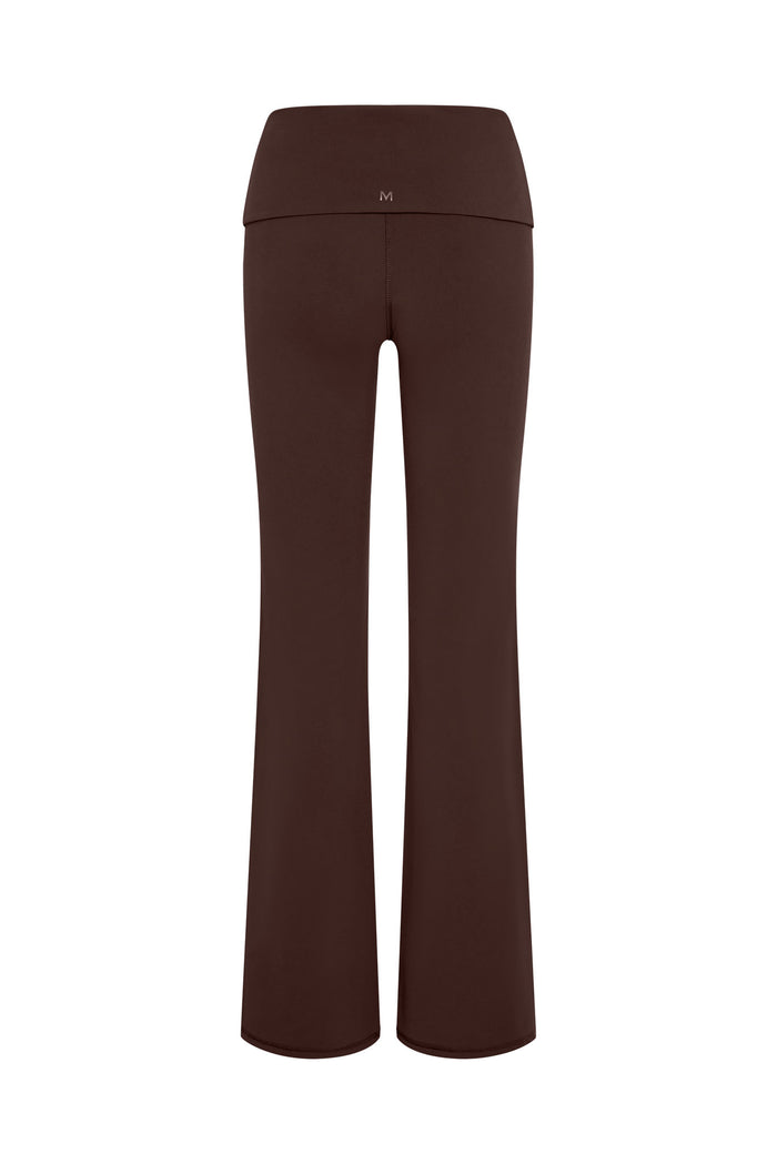 Back view of Melrose Flared Legging in Espresso showing fold-over high waistband and center-back M logo on white background