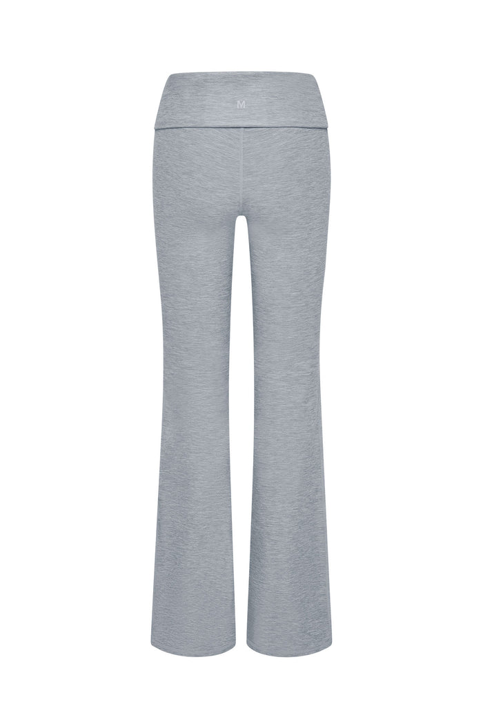 Back view of Melrose Flared Legging in heather gray showcasing fold-over high waistband and flared legs on white background