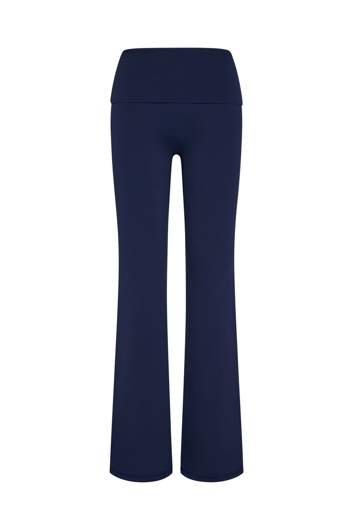 Front view of Melrose Flared Legging Long in Midnight with high foldover waistband and flared legs on white background