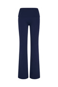 Front view of Melrose Flared Legging Long in Midnight with high foldover waistband and flared legs on white background