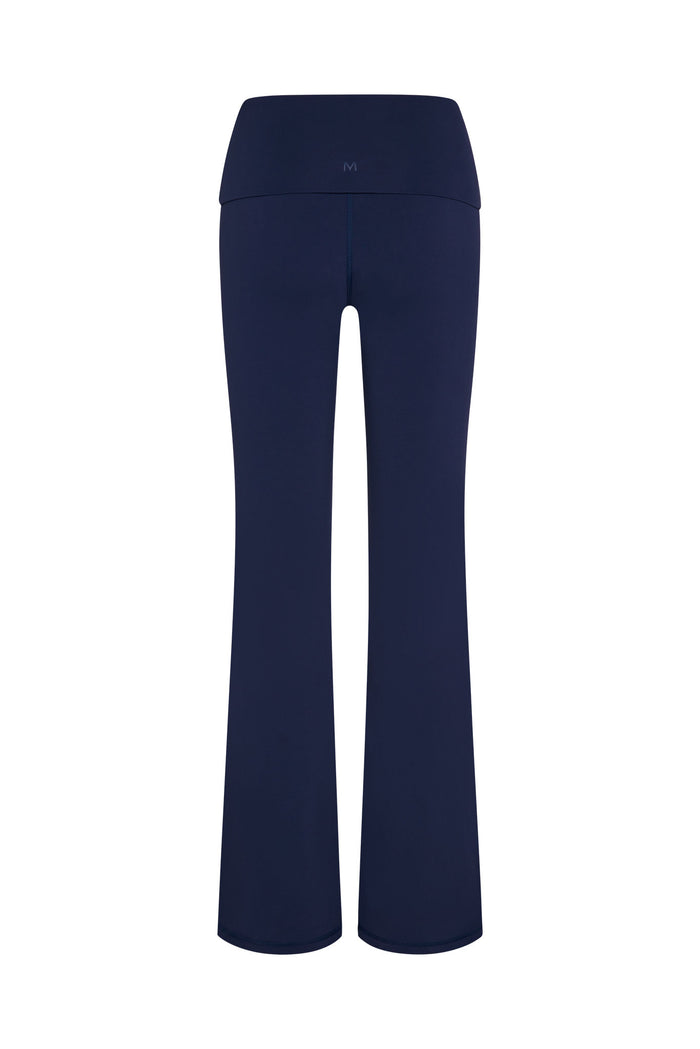 Back view of Melrose Flared Legging in midnight jersey showing fold-over high waistband and flared legs on white background