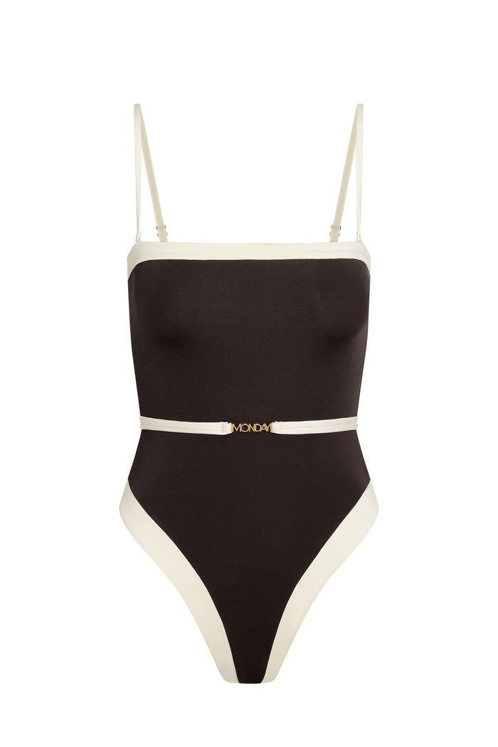 Front view of Miami One Piece in espresso with ivory trim, adjustable thin straps, high-cut leg, and thin belt with MONDAY logo on white background