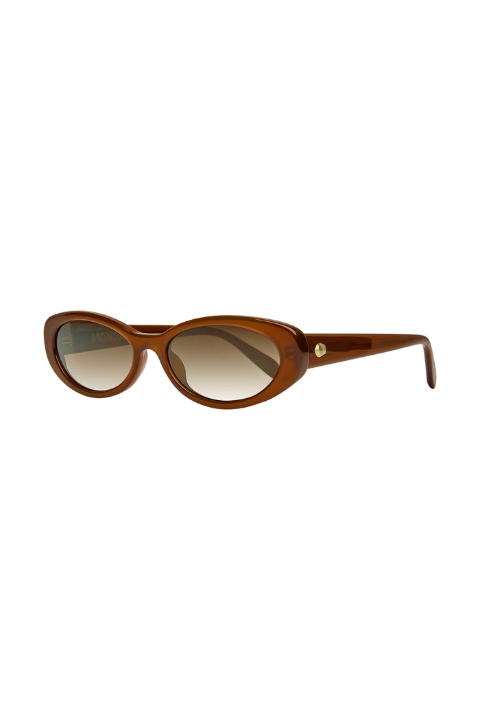 Brown cat-eye sunglasses with gradient lenses and gold rivet; inner arm text: MONDAY