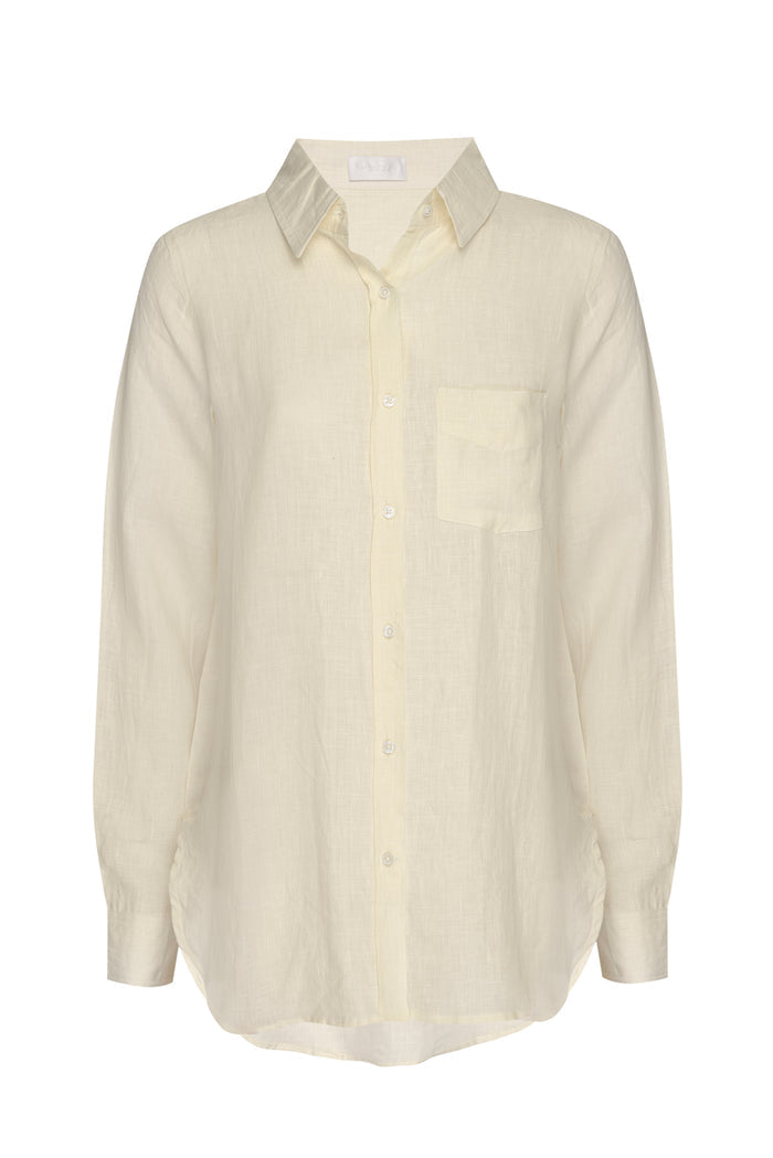 Cream linen long-sleeve button-up shirt with pointed collar and single chest pocket, relaxed fit.