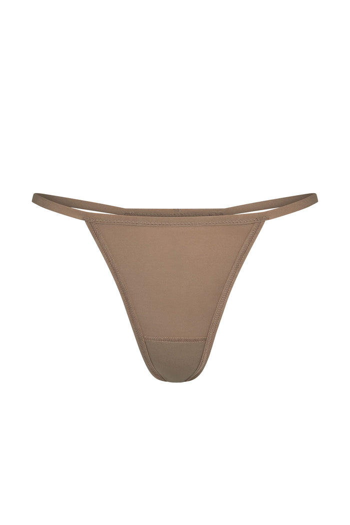 Front view of Monday G String thong in caramel showcasing double side straps and minimal coverage on white background