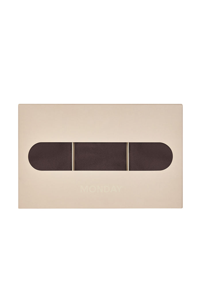 Front view of Monday G String 3-pack box showcasing three clove-colored g-strings visible through oval window on white background