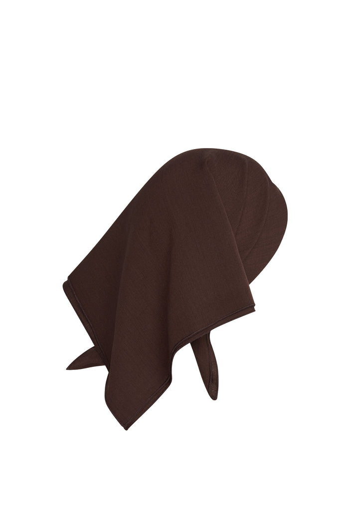 Three-quarter view of Monday Head Scarf in Espresso, draped to show square shape and lightweight rayon on white background