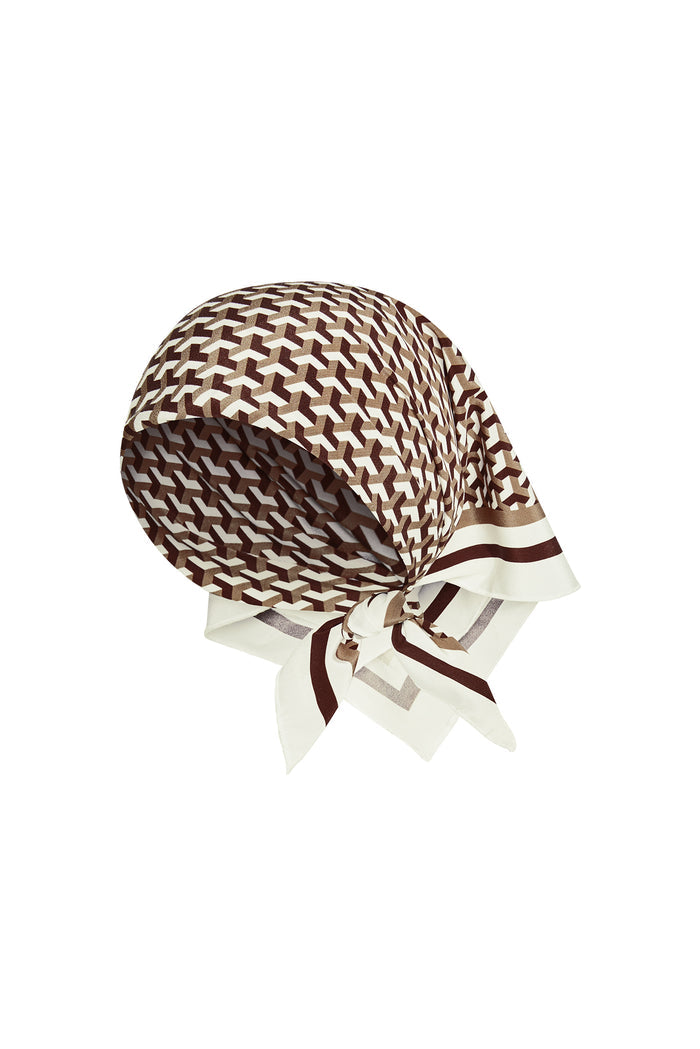 Three-quarter view of Monday Head Scarf Husk Geo Silk showcasing brown and ivory geometric silk print on white background