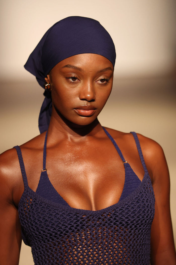 Close-up front view of Monday Head Scarf in Midnight showing smooth rayon fabric tied at the back on model against neutral studio background