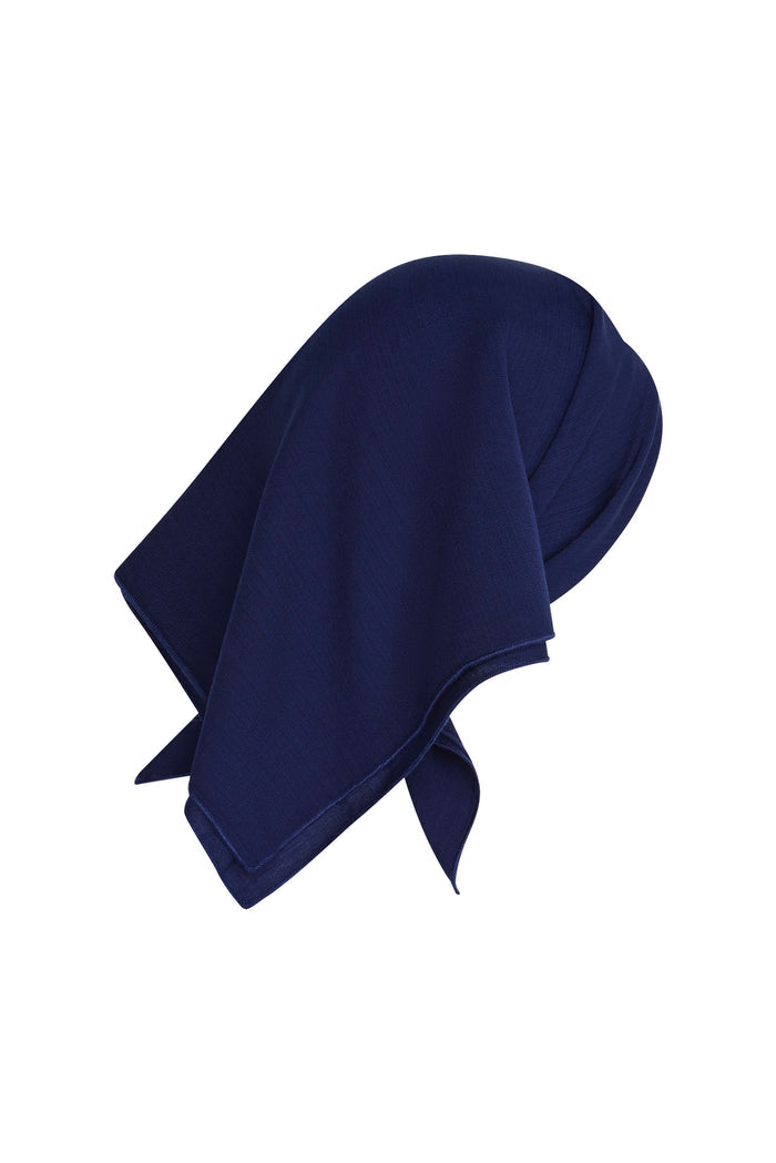 Close-up of Monday Head Scarf in Midnight showcasing square shape and draped corner on white background