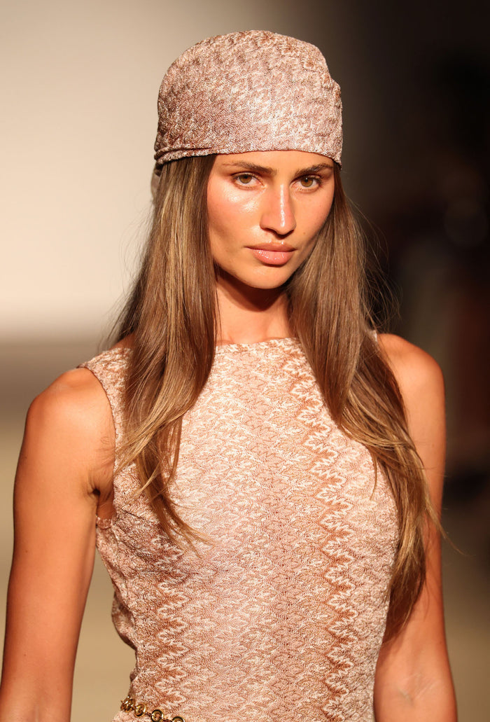 Close-up front view of Monday Head Scarf Porto Cervo Gold showcasing metallic textured square scarf tied as a head wrap with neutral studio background