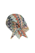 Front-right view of Monday Head Scarf Porto Cervo Multi showcasing multicolor leaf-and-zigzag print and tied front knot on white background