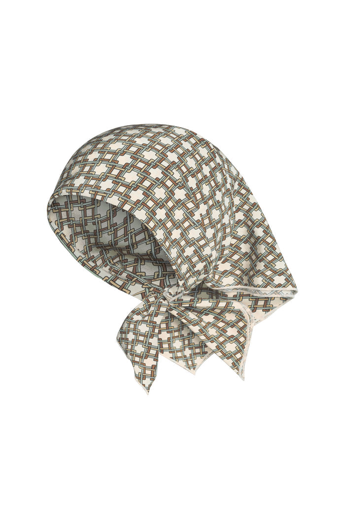 Angled front view of Monday Head Scarf (Tile Geo Silk) showcasing woven geometric tile pattern and smooth silk on a white background