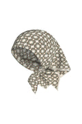 Angled front view of Monday Head Scarf (Tile Geo Silk) showcasing woven geometric tile pattern and smooth silk on a white background