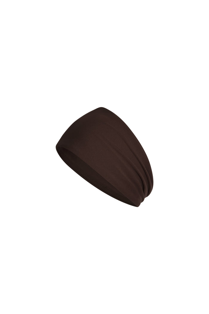 Angled close-up of Monday Headband in Espresso showcasing wide swim fabric silhouette with white background