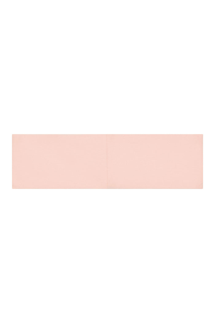 Flat lay of Monday Headband in Heather Powder Pink showing wide fabric band with center seam on white background