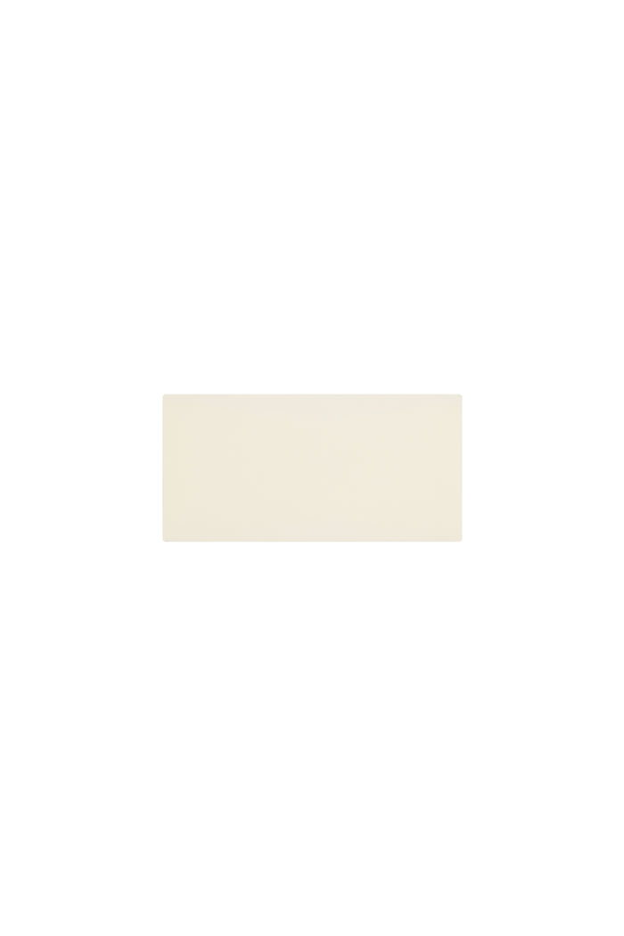Flat lay of Monday Headband in ivory showing wide swim-fabric silhouette on white background