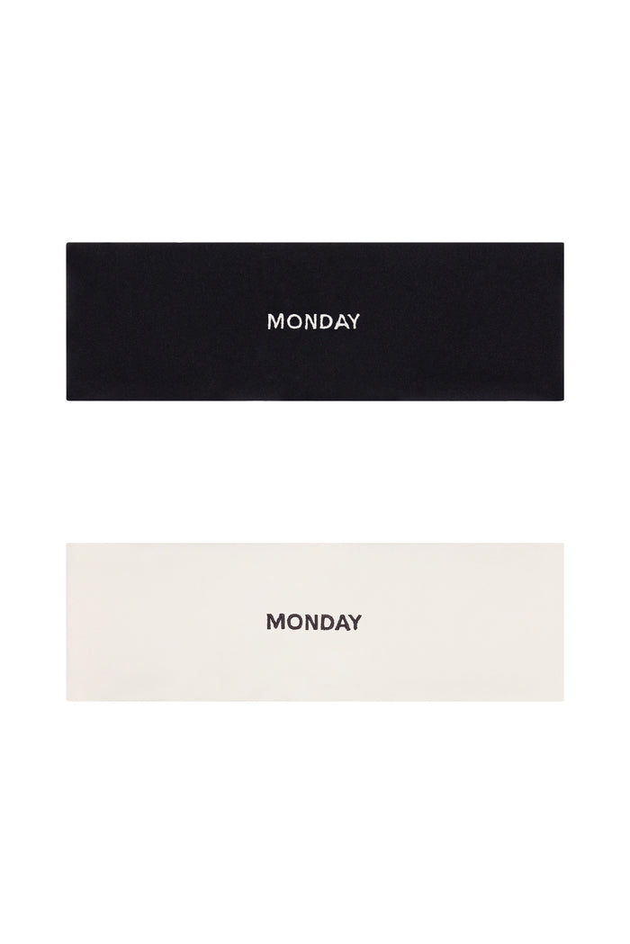 Flat lay of Monday Headband set (black and ivory) showing centered embroidered MONDAY on each headband on white background