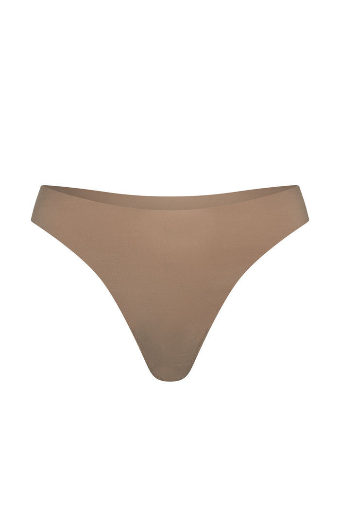 Front view of Invisible Thong showcasing seamless no-show edges in caramel on white background