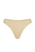 Front view of Invisible Thong in Cashmere showing mid-rise thong with raw-edge seamless finish on white background