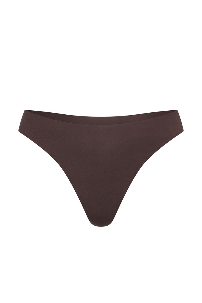 Front view of Invisible Thong in Clove showcasing mid-rise fit and raw-edge seamless finish on white background