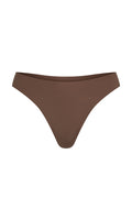 Front view of Monday Invisible Thong in mocha showcasing mid-rise cut and raw-edge seamless finish on white background