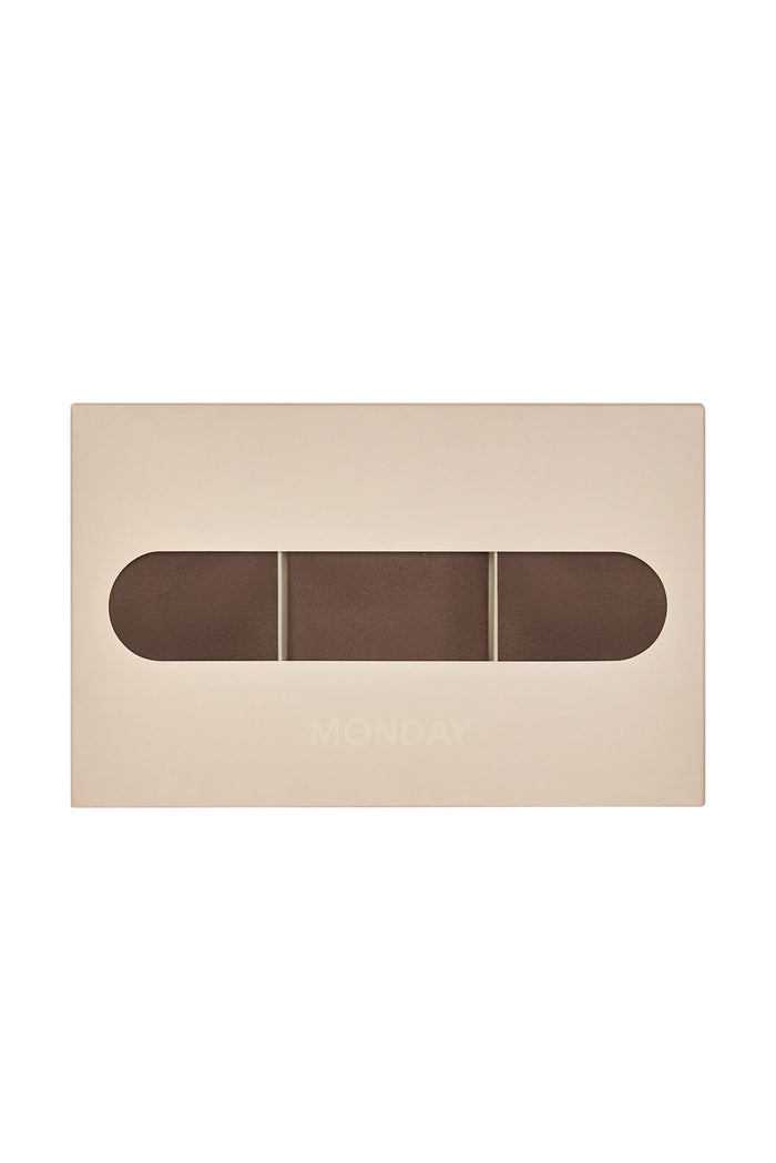 Top-down view of Monday Invisible Thong 3-pack in mocha showing three brown thongs through a beige box window