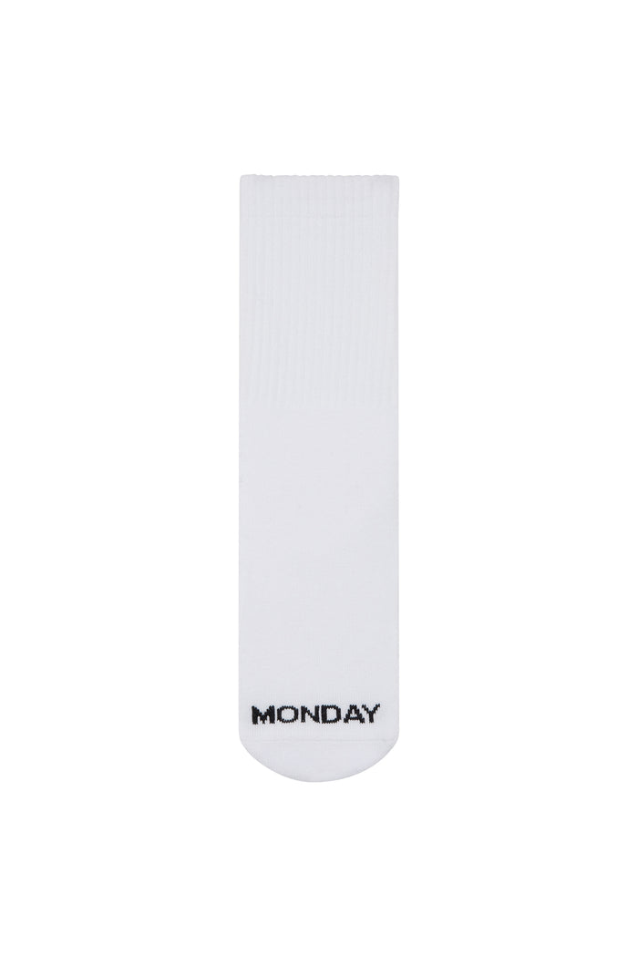 White crew sock with MONDAY stitched in black on the toe.