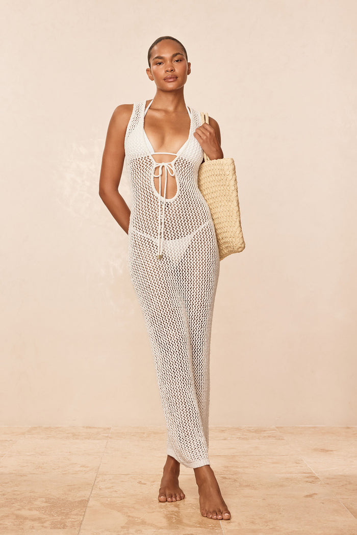 Front view of Monte Carlo Tie Dress in White Petit Crochet showing tie-front neckline and open-knit fabric on beige background
