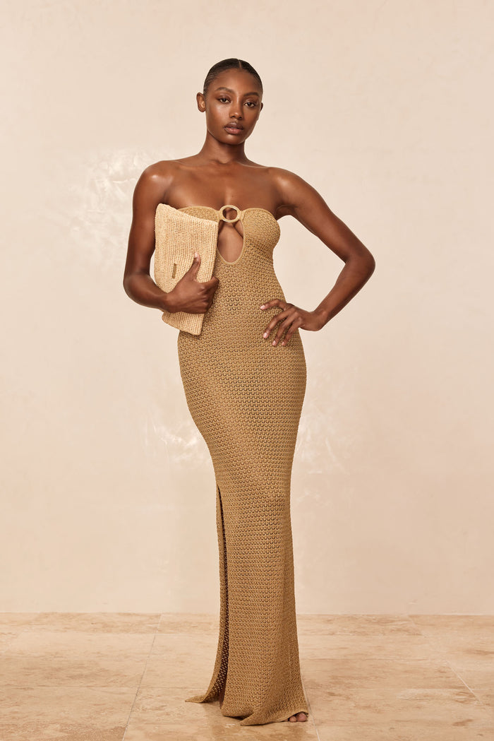 Front of Montego Bandeau Dress in antique gold crochet, strapless with center ring cutout, fitted with side slit