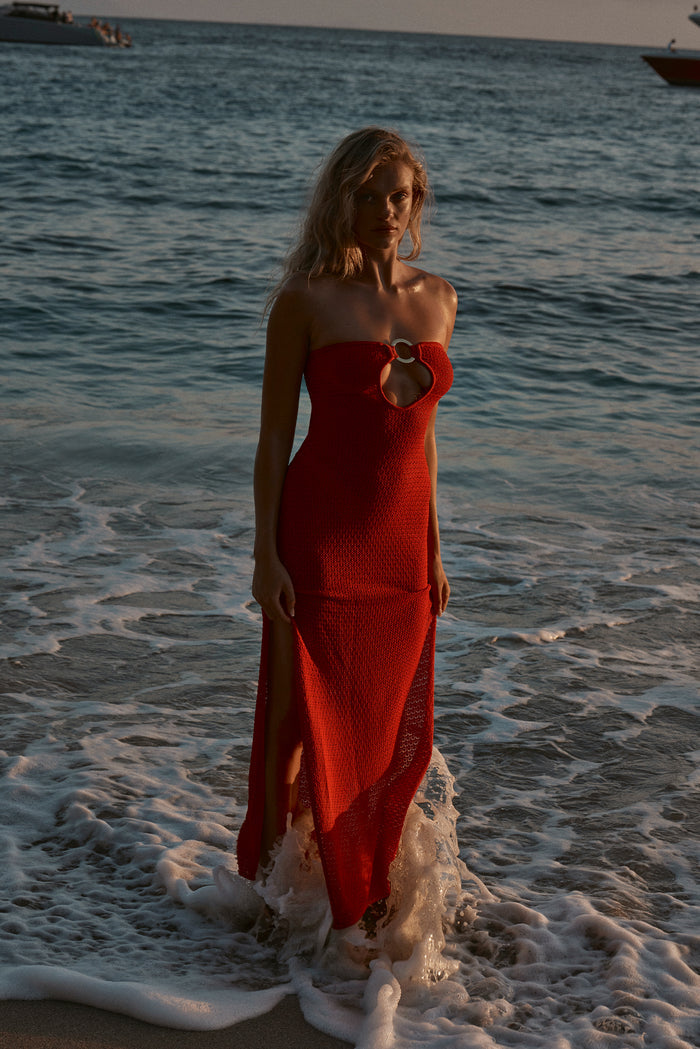 Front view of Montego Bandeau Dress in Chili Pepper lace crochet, strapless with circular front ring, ocean waves