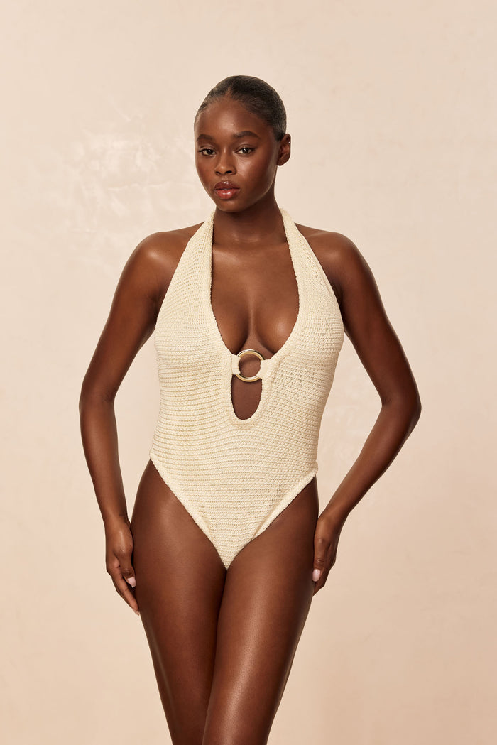 Front view of Montego bodysuit, ivory shiny treble knit, halter neck with deep plunge and gold ring