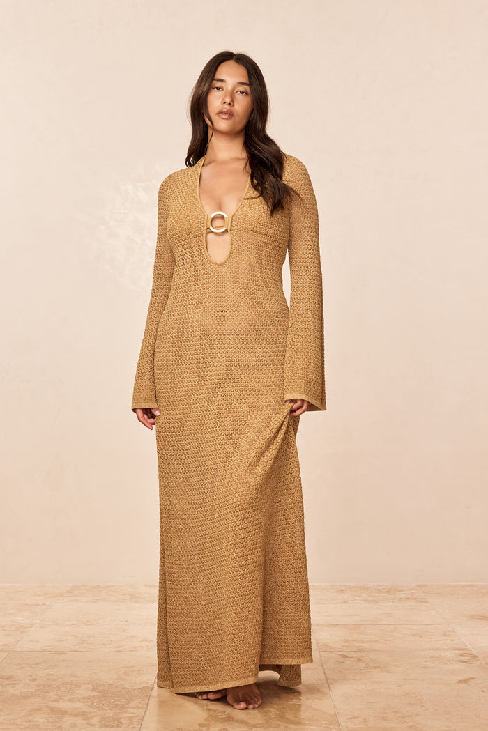 Front of Montego Dress in gold lurex crochet with deep keyhole and ring, long sleeves, floor-length