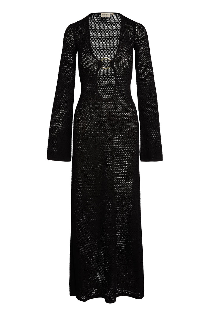 Black crochet maxi dress with long sleeves, plunging keyhole and circular buckle; neck label "MONDAY".