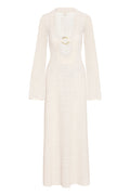 Front view of Montego Dress in ivory crochet with deep scoop neckline and gold ring, long bell sleeves, and floor-length skirt on white background