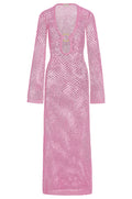 Front of Montego Dress in Moonlight pink crochet showing open-knit fabric, long sleeves and deep V with gold ring on white