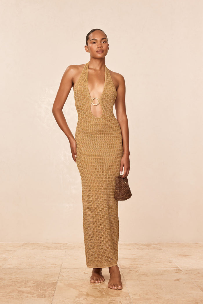 Front view of Montego Halter Dress in antique gold lurex lace crochet, halter with gold ring keyhole, slim fit on model