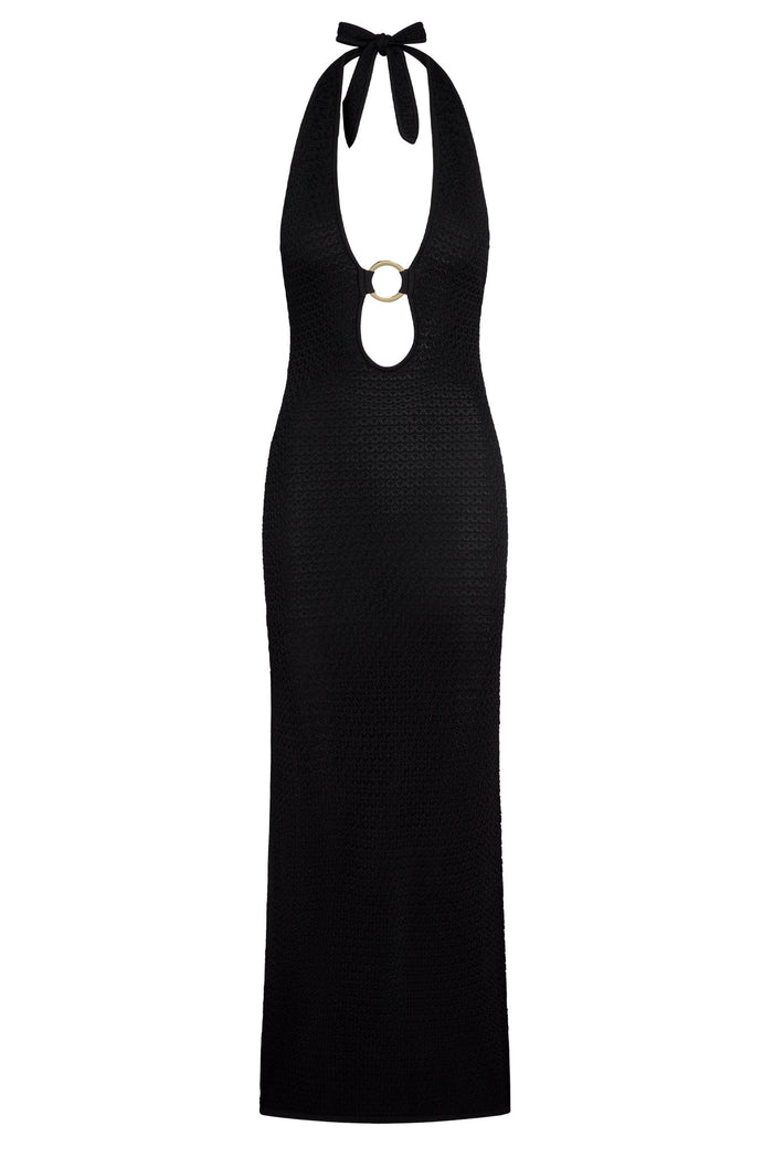 Front view of Montego halter dress in black crochet showcasing halter tie and gold ring cutout with fitted maxi on white