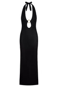Front view of Montego halter dress in black crochet showcasing halter tie and gold ring cutout with fitted maxi on white