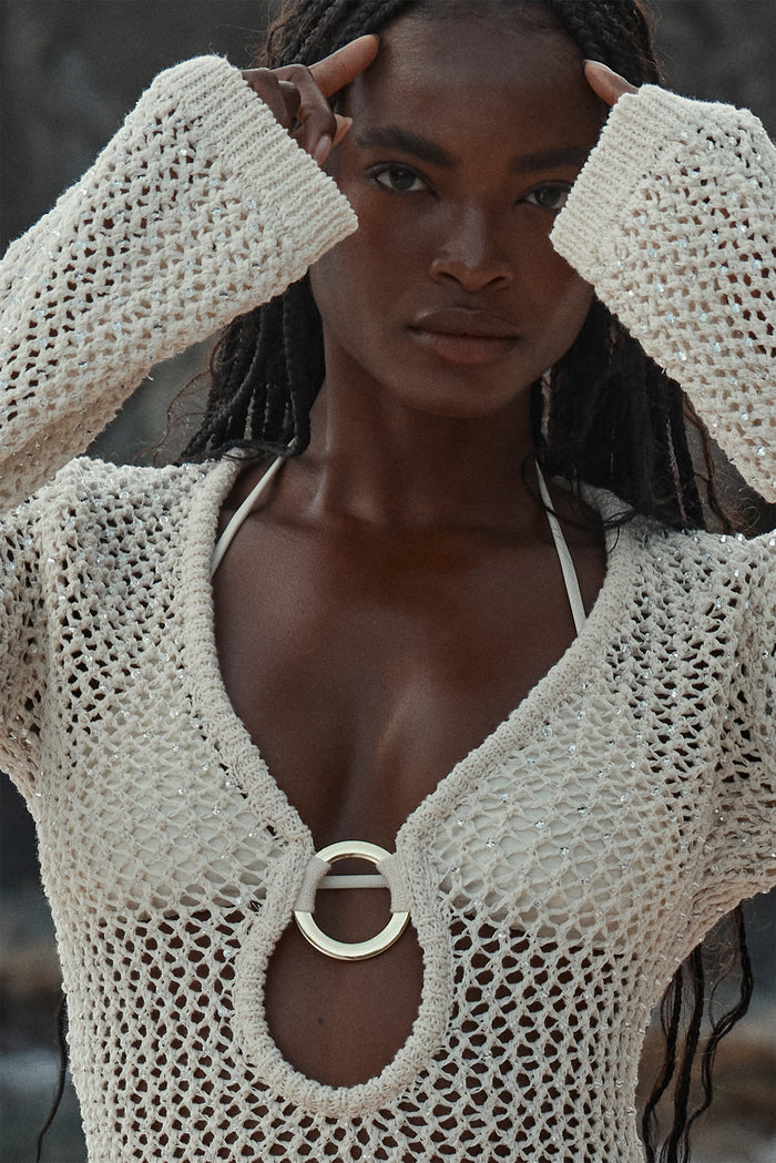 Close up of Montego Mini Dress in Ivory Diamond Crochet showing open knit texture, gold O ring at center front and white bikini straps