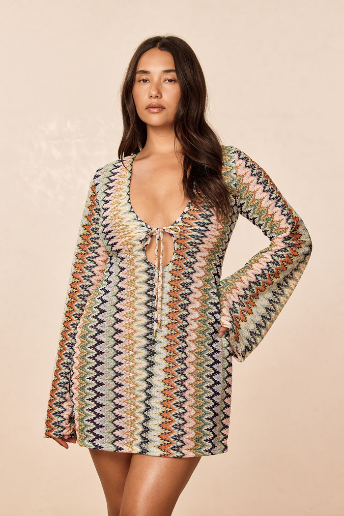 Front view of Montego Mini Tie Dress in Porto Cervo Multi with tie-front plunge, bell sleeves, and multicolor zigzag knit