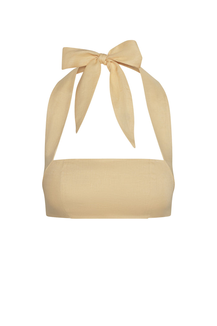 Front view of Montserrat Top in raffia linen showing bandeau shape and tied halter bow straps on white background