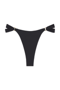 Front view of Morocco Bottom in black showing high-cut thong shape and knotted side ties with gold rings on white background
