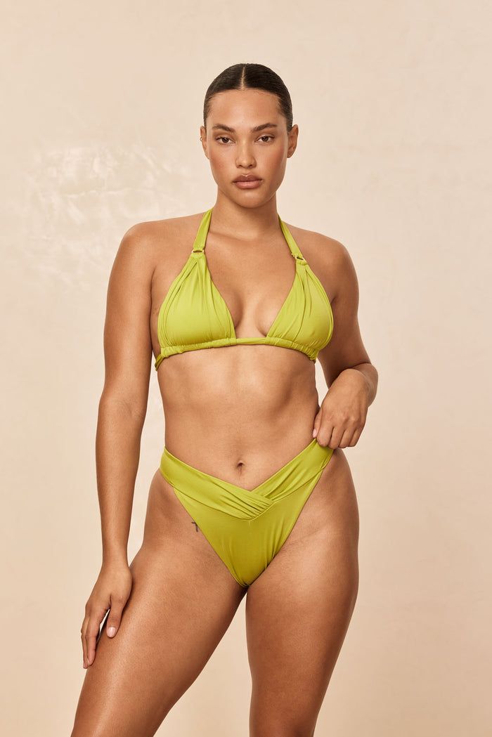 Front view of Marseille Bottom in Apple on model showcasing shirred V-front waist, high-leg cut and cheeky coverage