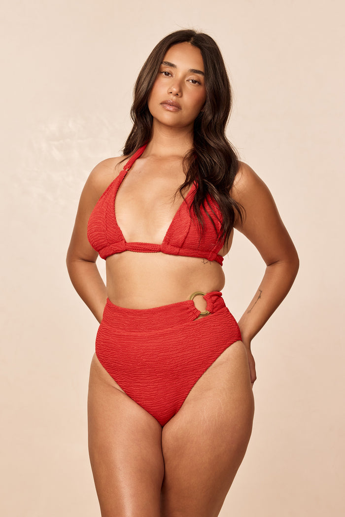 Front view of Morocco Top in Chili Pepper Crinkle showing red crinkle texture and halter neck tie on model with neutral studio background