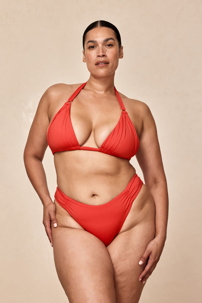 Front view of Clovelly High Leg Bottom in Chili Pepper on a plus-size model showing high-cut leg, shirred side hips, and mid-rise waist